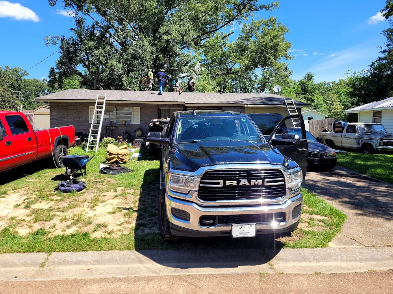 Roofing crew working on a single-story home