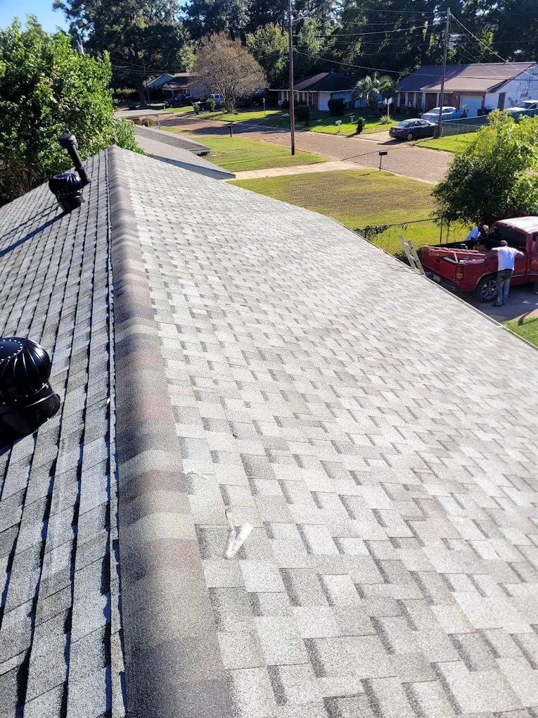 Gray shingle roof with ridge and roof vents