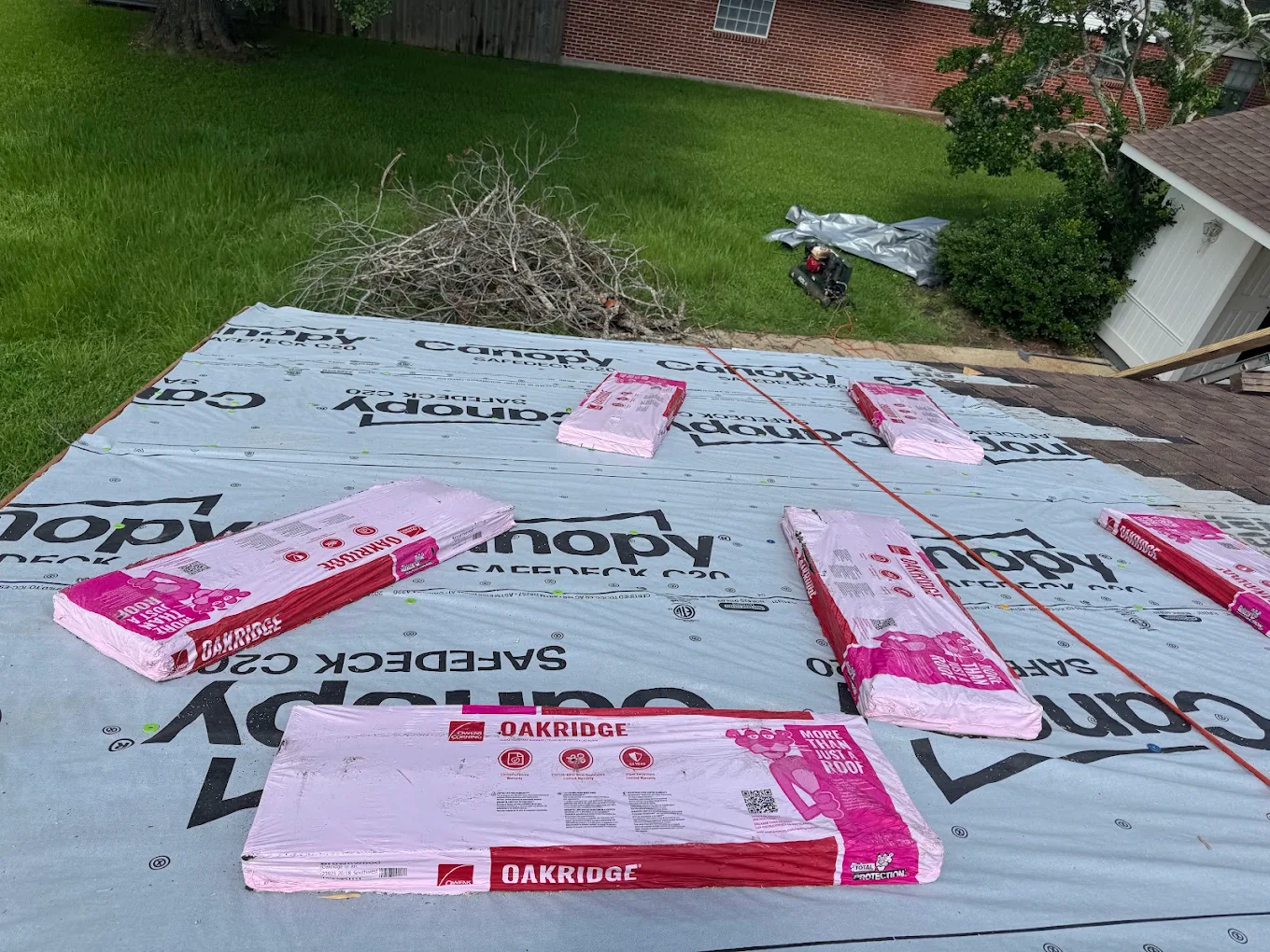 Roof deck prepared with underlayment and shingle bundles