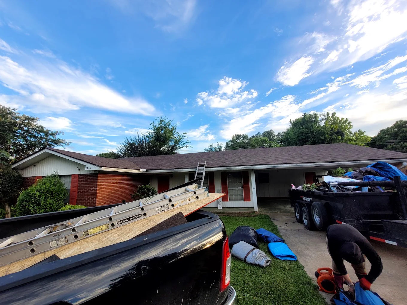 Roofing work underway at a single-story home